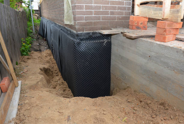 SJ Waterproofing Pros technician performing targeted Vapor Barrier Installation assessment in Chatfield, MN